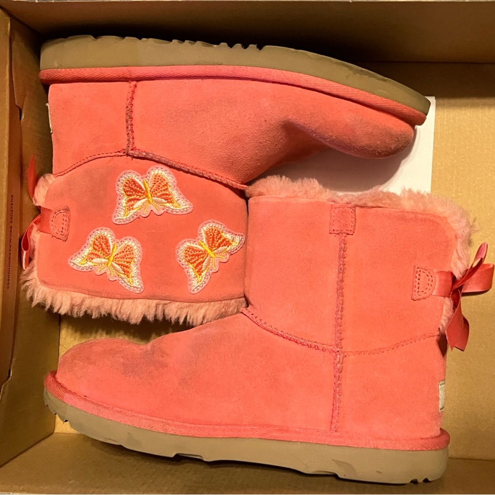 Girls pink UGG boots with butterflies